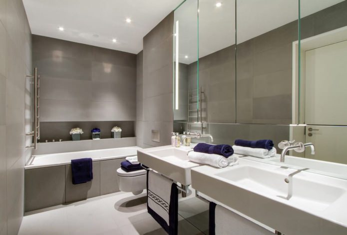 azulejos grises en el baño combinados con accesorios blancos