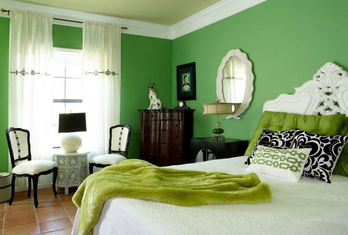 dormitorio verde en tono con textiles