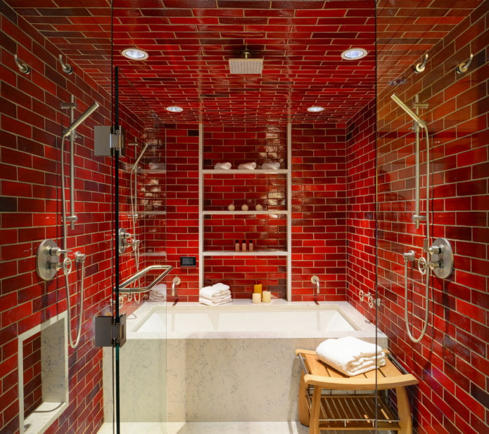 baño terminado con azulejos rojos