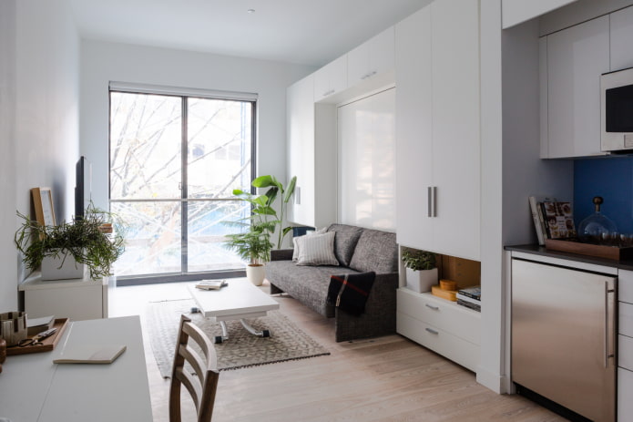 interior de un apartamento tipo estudio con una ventana