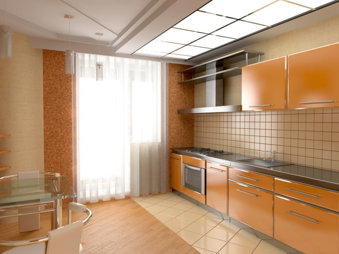 Interior de la cocina en colores beige y naranja.