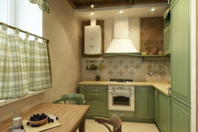 Interior de la cocina en tonos beige y verde.