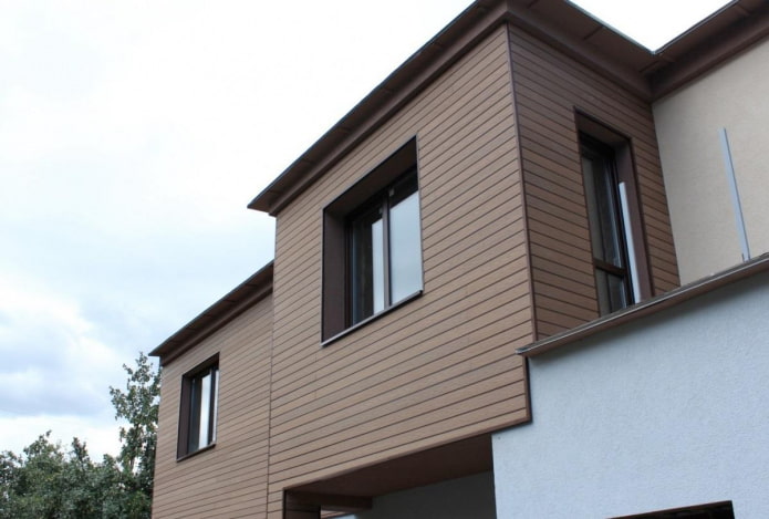 terminando la fachada de la casa con un tablero de terraza